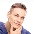 Image of male face with fingers stouching chin. Dermedicare Aesthetics and skin clinic in Swanland serving Hull and East Yorkshire