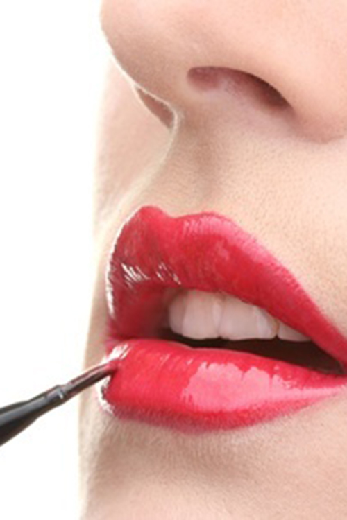 Image of red lipstick being applied
